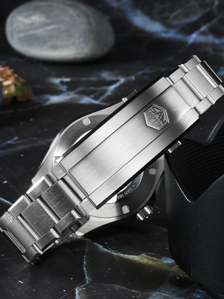 San Martin SN0129-G-D 200 meter dive watch tilted showing brushed steel bracelet width and secure folding clasp safety