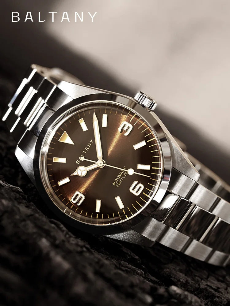 Baltany Explorer S204035 amber enamel dial with applied hour markers and silver hands beneath dome sapphire crystal