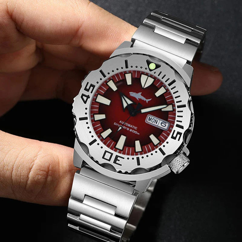 Top-down view revealing the NH36A automatic movement's precision through the Heimdallr Ocean Monster's luminous hands against blue dial