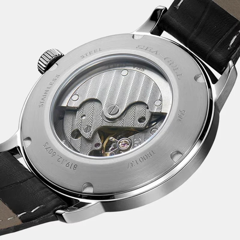 Closeup of Sea-Gull 1955 automatic mechanical watch showing numberless dial design and polished steel bracelet