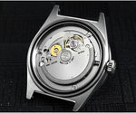 Orange mother of pearl guilloche finish on San Martin diver captures light with 39mm stainless steel case