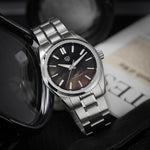 Watchdives WD0003C Elementum with aventurine dial catching light, sapphire crystal reflects Swiss-grade luxury in compact 38mm case