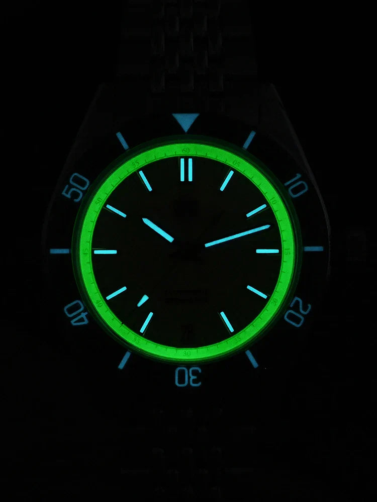Sapphire bezel assembly on SN0116-G-B showing luminous markers and 120 click detents for dive timing precision