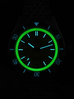 Sapphire bezel assembly on SN0116-G-B showing luminous markers and 120 click detents for dive timing precision