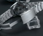 Close-up of the Cronos Arctic Ice texture dial with BGW-9 luminous hands and complete calendar complications visible
