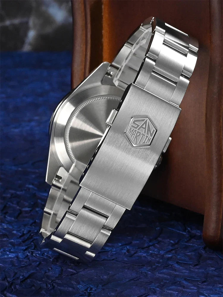 Macro shot of snowflake hands and GMT central hour hand on San Martin mechanical watch with luminous blue light effect