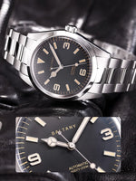 Brushed stainless steel bracelet on Baltany Explorer watch showcasing upgraded scratch-resistant link construction and double push button folding clasp